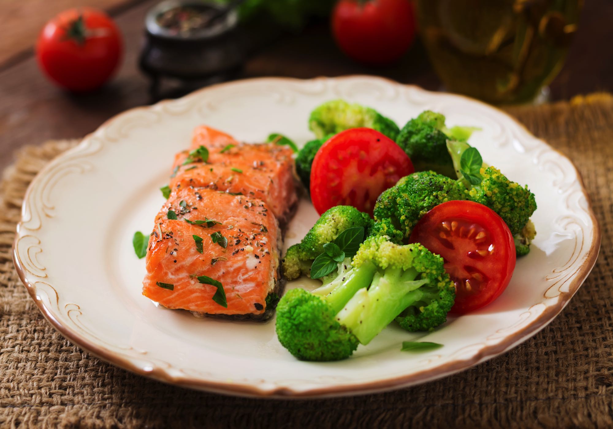 baked-fish-salmon-garnished-with-broccoli-and-toma-PBKGZRK.jpg